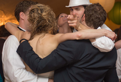 Friends arm in arm at the best wedding ever!